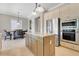 Open kitchen featuring a kitchen island, stainless steel appliances, and tile floors at 1021 Castle Pines Ct, Reunion, FL 34747
