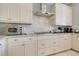 Well-equipped kitchen features stainless steel appliances and custom cabinetry for ample storage at 1021 Castle Pines Ct, Reunion, FL 34747