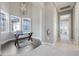 Office with hardwood floors, bay windows, natural light, and a glass desk at 1021 Castle Pines Ct, Reunion, FL 34747