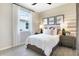 Cozy bedroom featuring neutral tones, stylish decor, and a comfortable bed at 1034 Wisteria Way, Dundee, FL 33838