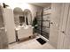 Well-appointed bathroom featuring double sinks, a glass-enclosed shower, and modern tile, creating a spa-like experience at 11273 Amber Ridge Dr, Zellwood, FL 32798