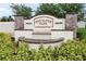 Westridge Park entrance featuring a stone monument with water feature and lush landscaping at 11273 Amber Ridge Dr, Zellwood, FL 32798