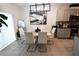 Elegant dining room adjacent to the kitchen, featuring stylish decor and ample natural light at 11273 Amber Ridge Dr, Zellwood, FL 32798