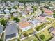 Scenic aerial view of a residential neighborhood, showcasing various homes and tree-lined streets at 1176 Epson Oaks Way, Orlando, FL 32837
