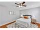 Inviting bedroom with a ceiling fan, warm lighting and tasteful artwork for a relaxing atmosphere at 1176 Epson Oaks Way, Orlando, FL 32837