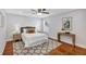 Well-lit bedroom featuring neutral tones and a ceiling fan for a comfortable and inviting space at 1176 Epson Oaks Way, Orlando, FL 32837