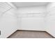 Walk-in closet features tiled floors and wire shelving at 1176 Epson Oaks Way, Orlando, FL 32837