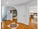 Inviting entryway with decorative tile leads to a living area and bedroom, showcasing the home's layout at 1176 Epson Oaks Way, Orlando, FL 32837