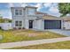 Charming two-story home with a well-maintained lawn and a two-car garage, located in a Gathering-friendly neighborhood at 1176 Epson Oaks Way, Orlando, FL 32837
