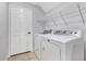 Laundry room with tiled floors, washer and dryer at 1176 Epson Oaks Way, Orlando, FL 32837
