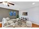 Comfortable living room features a ceiling fan and stylish décor at 1176 Epson Oaks Way, Orlando, FL 32837
