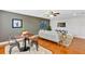Open living space with a dining table and stylish décor at 1176 Epson Oaks Way, Orlando, FL 32837