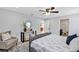 Comfortable main bedroom boasts a stylish area rug, and decoratively arranged accessories at 1176 Epson Oaks Way, Orlando, FL 32837