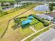 A community playground, shaded with blue canopies, offers recreational space at 1176 Epson Oaks Way, Orlando, FL 32837