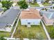 A backyard, sliding doors, and fencing is the focus of this aerial real estate shot at 1176 Epson Oaks Way, Orlando, FL 32837