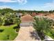 Aerial shot of home featuring lush landscaping and well manicured yard at 1306 Harbor Ridge Dr, Kissimmee, FL 34759