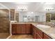 Bathroom boasts double sinks, granite countertops, and a seamless glass shower enclosure at 1306 Harbor Ridge Dr, Kissimmee, FL 34759