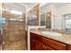 Modern bathroom featuring granite countertops, double sinks, and a seamless glass shower at 1306 Harbor Ridge Dr, Kissimmee, FL 34759