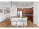 Open kitchen featuring stainless steel appliances, a breakfast bar, and stylish pendant lighting at 1306 Harbor Ridge Dr, Kissimmee, FL 34759