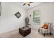 Bright living room featuring modern art, a unique coffee table, a comfortable chair, and natural light at 1306 Harbor Ridge Dr, Kissimmee, FL 34759