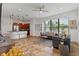 Open living room boasts modern finishes, tile floors, and a view of the manicured front yard at 1306 Harbor Ridge Dr, Kissimmee, FL 34759