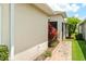 Side exterior of house with decorative foliage and brick walkway at 1306 Harbor Ridge Dr, Kissimmee, FL 34759