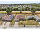 Aerial view of a solar-paneled home in a suburban neighborhood, showcasing its location at 131 Highland Meadows Pl, Davenport, FL 33837