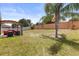 Spacious backyard with a shaded patio area, offering ample space for outdoor activities at 131 Highland Meadows Pl, Davenport, FL 33837