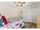 Bedroom with wood-look floors, neutral walls, and large closet at 131 Highland Meadows Pl, Davenport, FL 33837