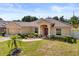 Well-maintained home with landscaped front yard, featuring a front-facing garage and a classic design at 131 Highland Meadows Pl, Davenport, FL 33837
