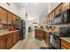 Well-equipped kitchen featuring granite countertops, mosaic tile backsplash, and modern appliances at 131 Highland Meadows Pl, Davenport, FL 33837
