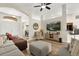 Inviting living room with vaulted ceiling, neutral color palette and modern furnishings at 131 Highland Meadows Pl, Davenport, FL 33837
