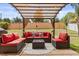 Outdoor patio area with comfortable seating, creating an ideal space for relaxation at 131 Highland Meadows Pl, Davenport, FL 33837