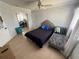 Comfortable bedroom featuring neutral walls, tiled floors, and a plush chaise lounge at 1505 Chevington Ct, Orlando, FL 32824