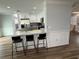 Spacious kitchen with bar seating, white cabinets, and granite countertops at 1505 Chevington Ct, Orlando, FL 32824