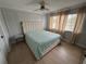 Bright main bedroom with panel molding accent wall, neutral colors, and ample natural light at 1505 Chevington Ct, Orlando, FL 32824