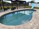 Private in-ground pool, built-in slide, and pergola with an outdoor dining area, ideal for entertaining at 1505 Chevington Ct, Orlando, FL 32824