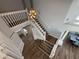 Bright foyer features a modern light fixture, staircase, and an open view of the dining area at 1505 Chevington Ct, Orlando, FL 32824