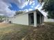 Exterior back view featuring a covered patio area, perfect for outdoor entertaining at 15408 Groose Point Ln, Clermont, FL 34714