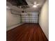 Attached garage with clean flooring, mechanicals, and door with automatic opener at 15408 Groose Point Ln, Clermont, FL 34714