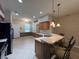 Kitchen counter and bar seating area, with view to dining area at 15408 Groose Point Ln, Clermont, FL 34714