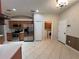 Bright kitchen with stainless steel appliances and a laundry room at 15408 Groose Point Ln, Clermont, FL 34714