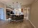 Kitchen area with a breakfast bar and view to the dining room at 15408 Groose Point Ln, Clermont, FL 34714