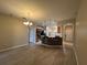 Open-concept living room features a breakfast bar and views of the kitchen at 15408 Groose Point Ln, Clermont, FL 34714
