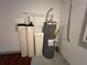 Installed water filtration and water heater system in a utility space at 15408 Groose Point Ln, Clermont, FL 34714