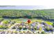 Beautiful aerial view of a residential area with lush green trees and a serene lake at 156 Bristol Forest Trl, Sanford, FL 32771