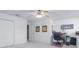 Neutral bedroom with a ceiling fan, closet, and small desk, creating a versatile space at 156 Bristol Forest Trl, Sanford, FL 32771