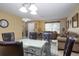 Dining room with seating for six and open concept layout to the living room at 156 Bristol Forest Trl, Sanford, FL 32771