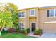 Charming two-story home with a well-manicured lawn, lush landscaping, and a welcoming front entrance at 156 Bristol Forest Trl, Sanford, FL 32771