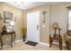 Inviting foyer featuring tile flooring, neutral wall paint, and decorative accents at 156 Bristol Forest Trl, Sanford, FL 32771